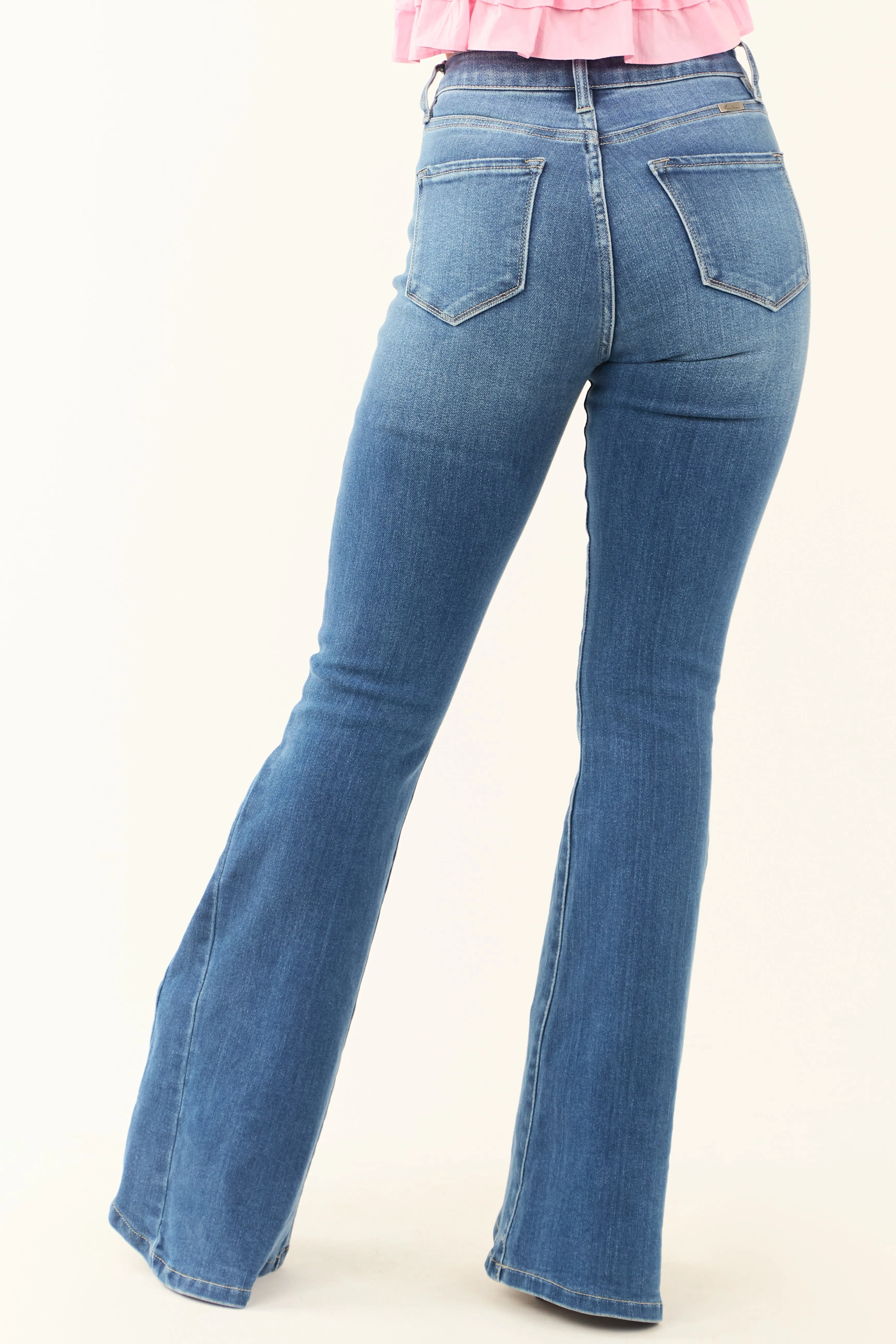KanCan Medium Wash Angled Hem Flare Leg Jeans confident look