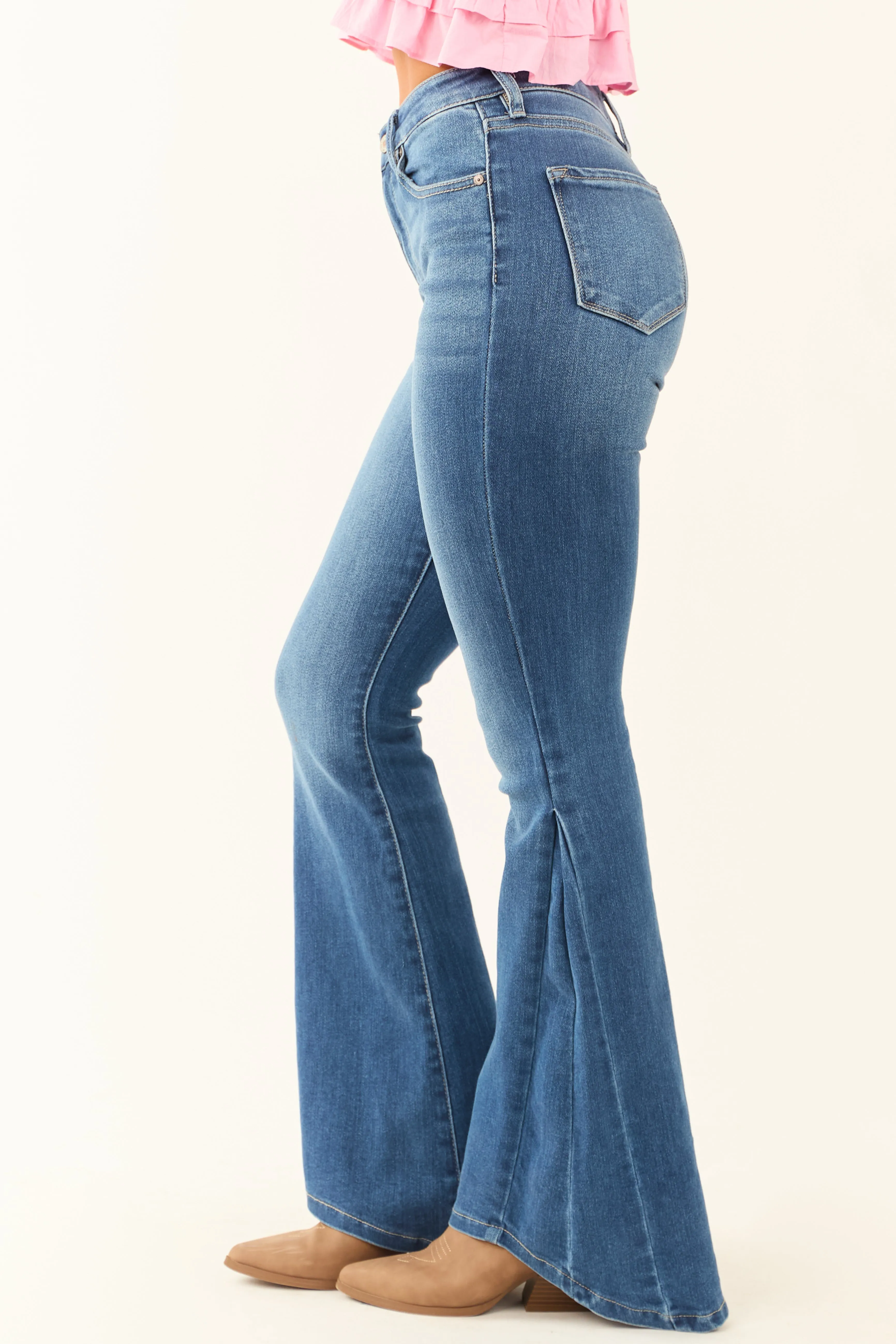 KanCan Medium Wash Angled Hem Flare Leg Jeans confident look